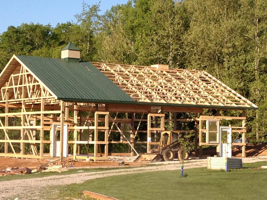 A barn being built with wood